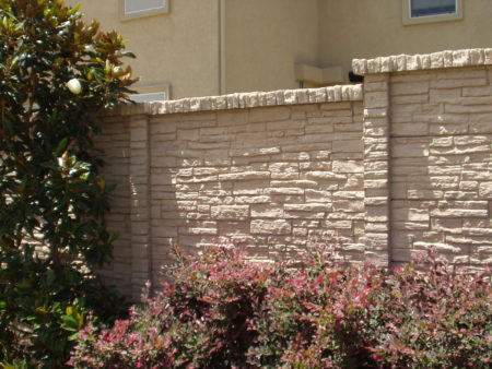 Masonry privacy fence with varied heights