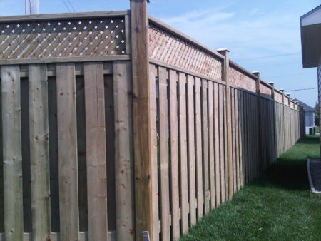 Board on board corner angle shot of a wood privacy Fence